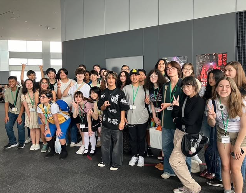 Students and staff gathered at the airport